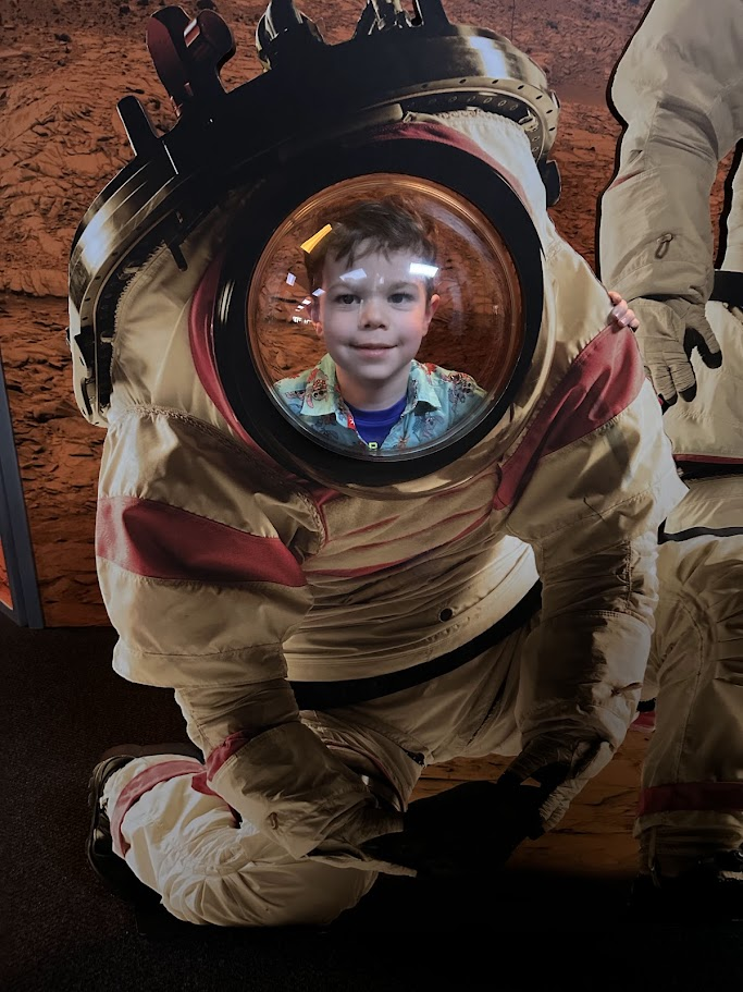 Scout in spacesuit exhibit at Tellus
